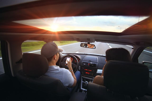 A man texting and driving.