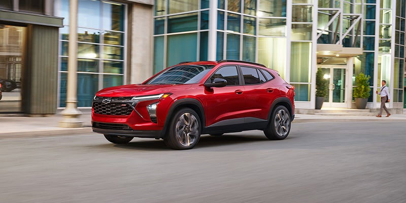2026 Chevrolet Trax driver using safety assist features on a city road in Newton Falls OH