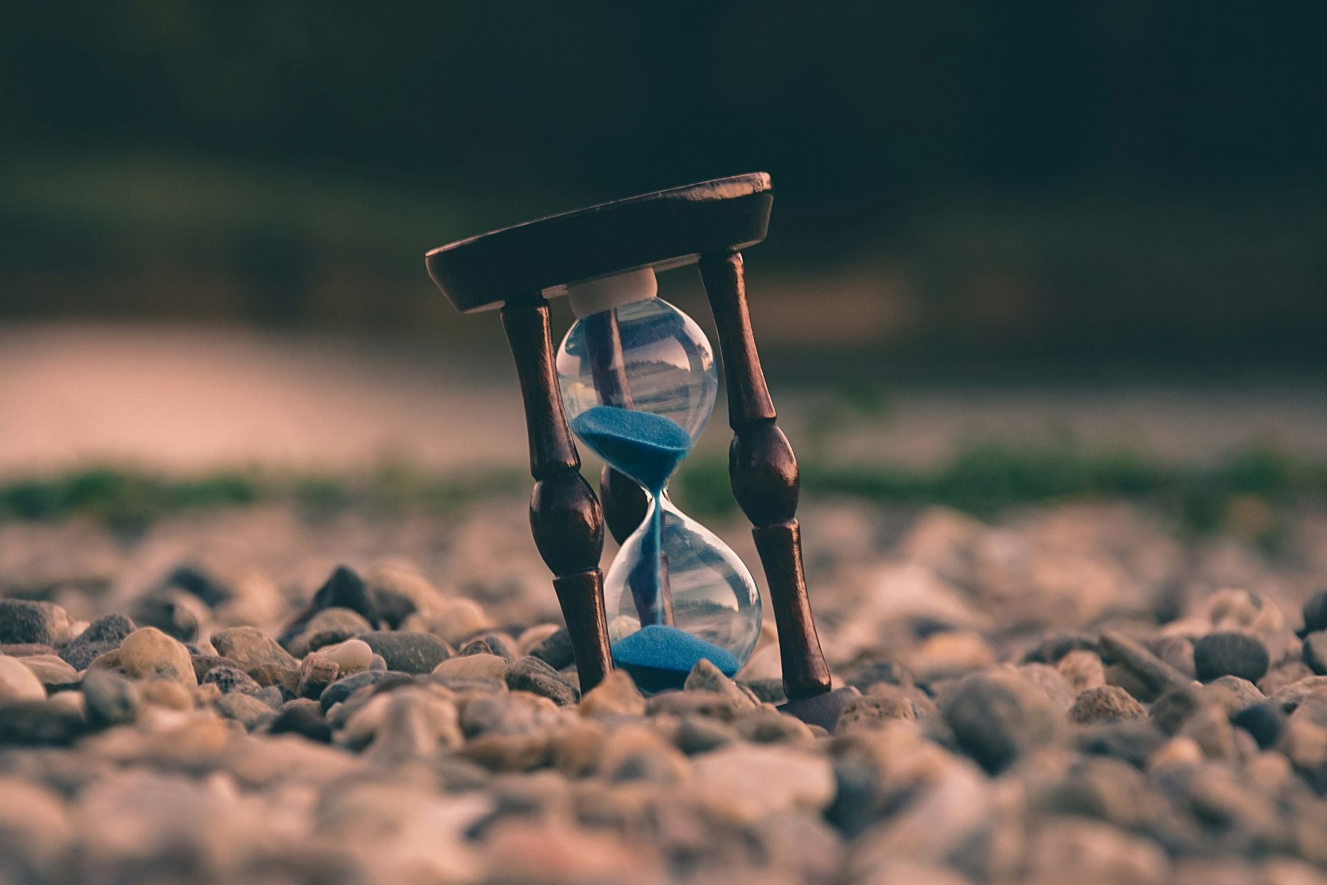 Hourglass with blue sand inside