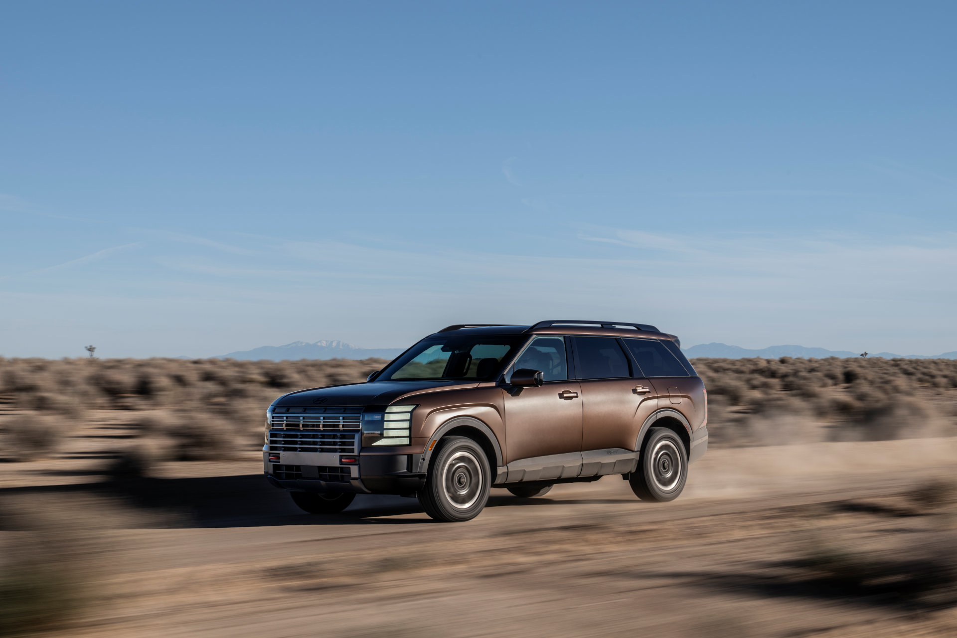 2026-Hyundai-Palisade-driving-on-dirt-road-in-desert