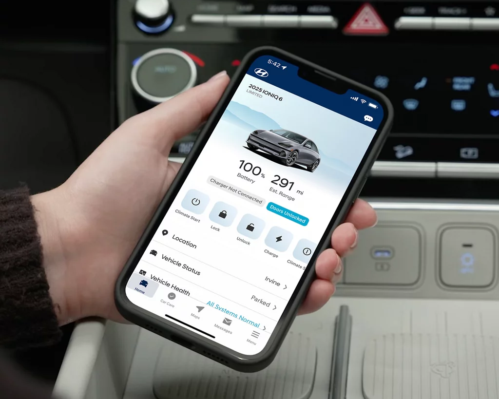 hand holding phone with Hyundai Bluelink app inside car