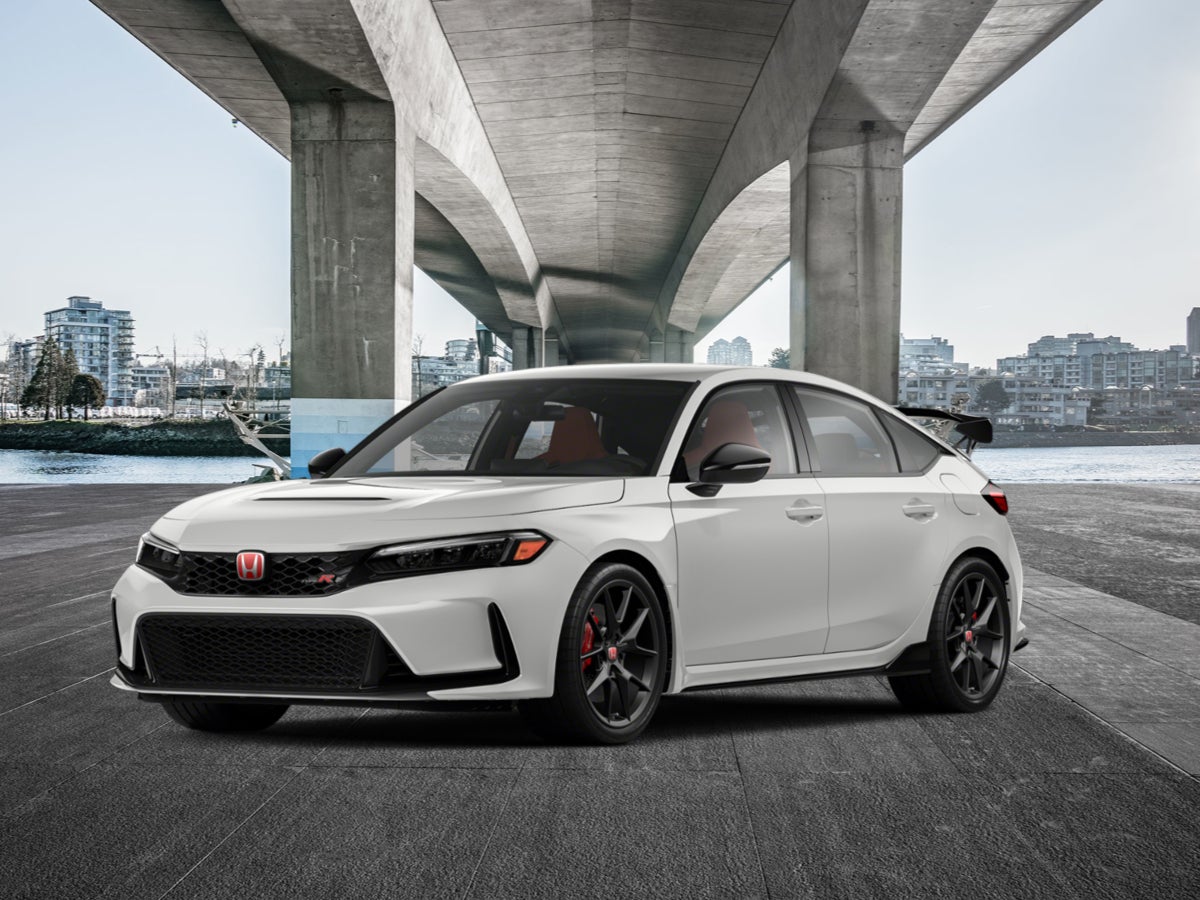 A white 2024 Honda Civic Type R parked under a bridge