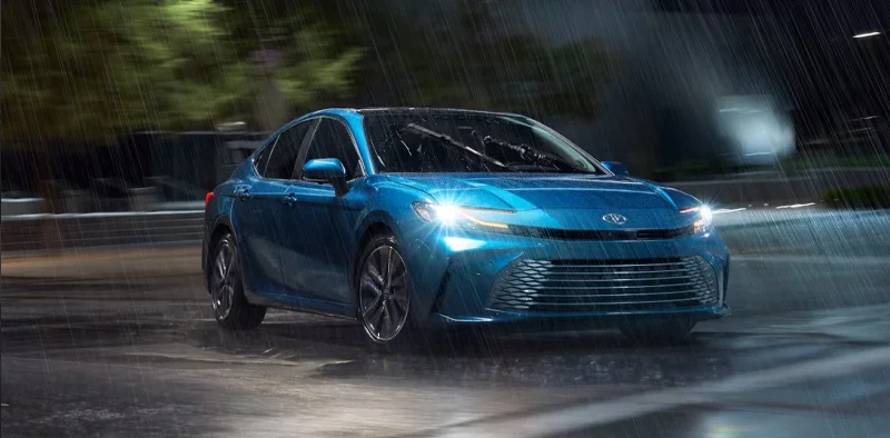 A 2025 Toyota Crown parked outside in the rain.