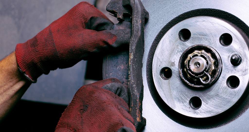 A photo of car brakes being worked on.