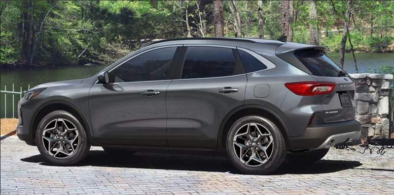 A silver 2026 Ford Escape parked by a river.