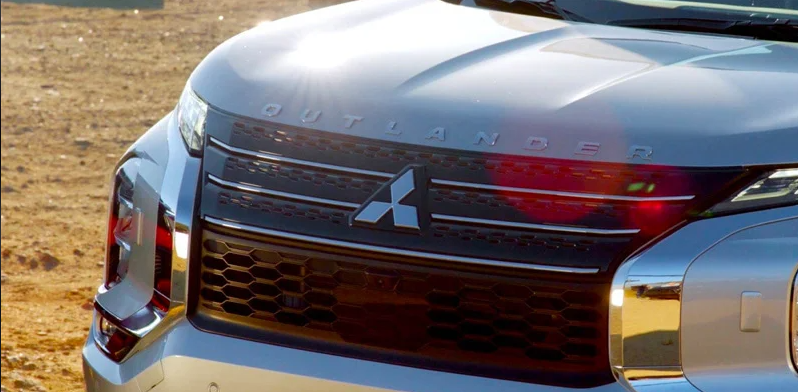A Photo of the front of a silver 2024 Mitsubishi Outlander.