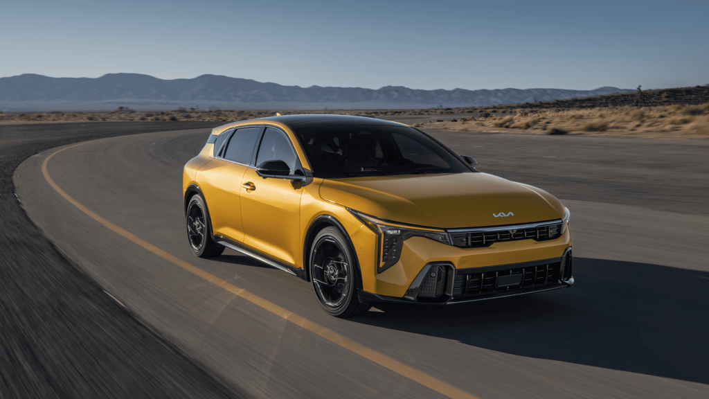 2026 Kia K4 Hatchback in an open road riding under the sun. 