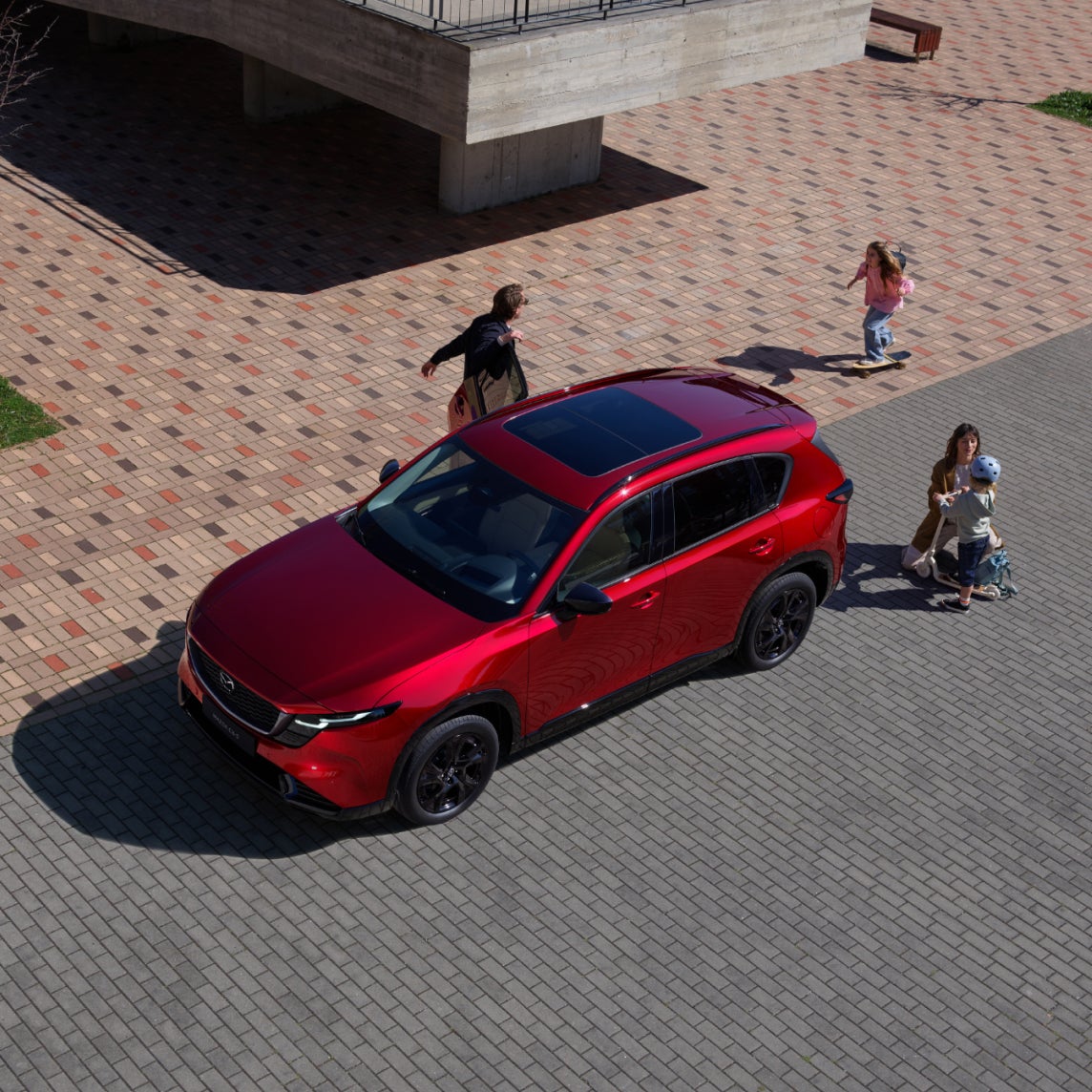 family loading up in the mazda cx-5