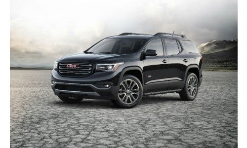 2018 GMC Acadia black on dry cracked ground like a salt lake