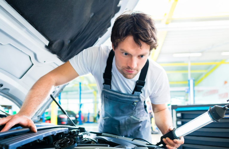 Mechanic inspecting a vehicle