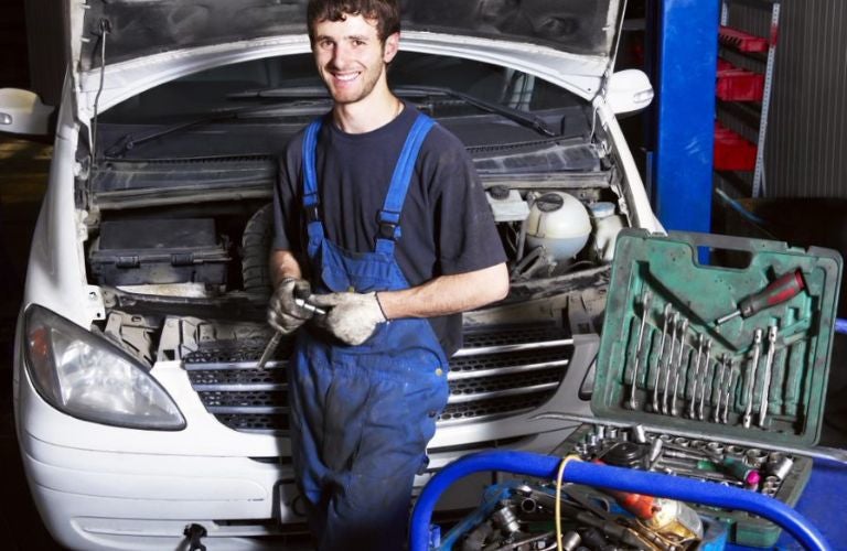 Mechanic posing with his toolbox