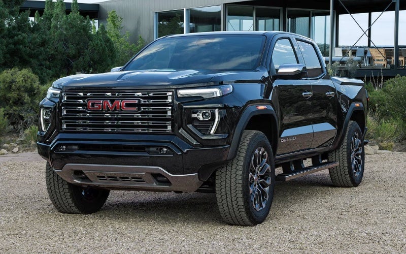 Is the 2026 GMC Canyon or 2026 Toyota Tacoma better for towing and trails around Castle Rock, CO?