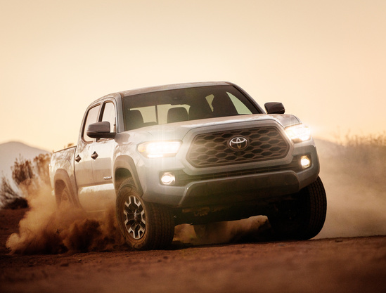Silver Toyota Tacoma off roading