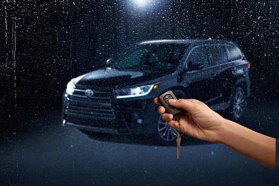 Black Toyota SUV in the rain