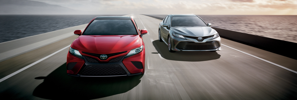 2019 Toyota Red and Silver driving down road