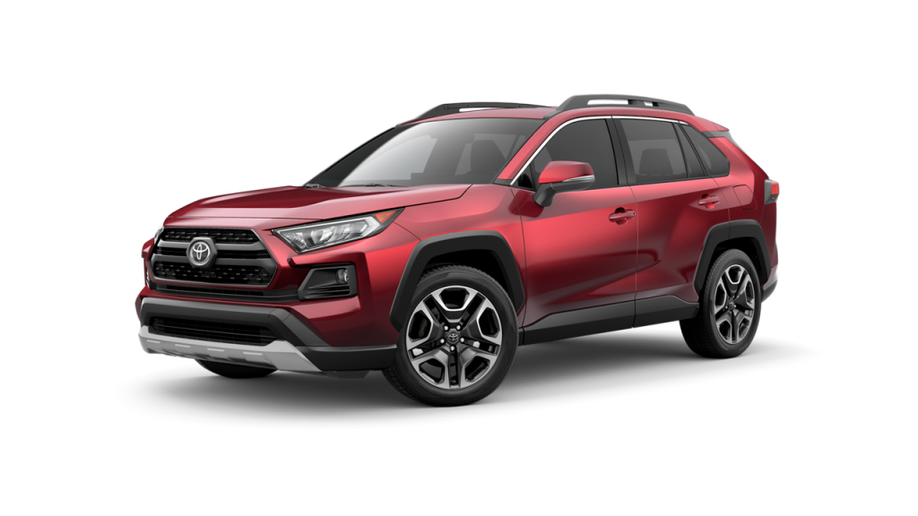 A red Toyota SUV is shown at an angle on a white background, highlighting its sleek design, modern grille, and black alloy wheels.