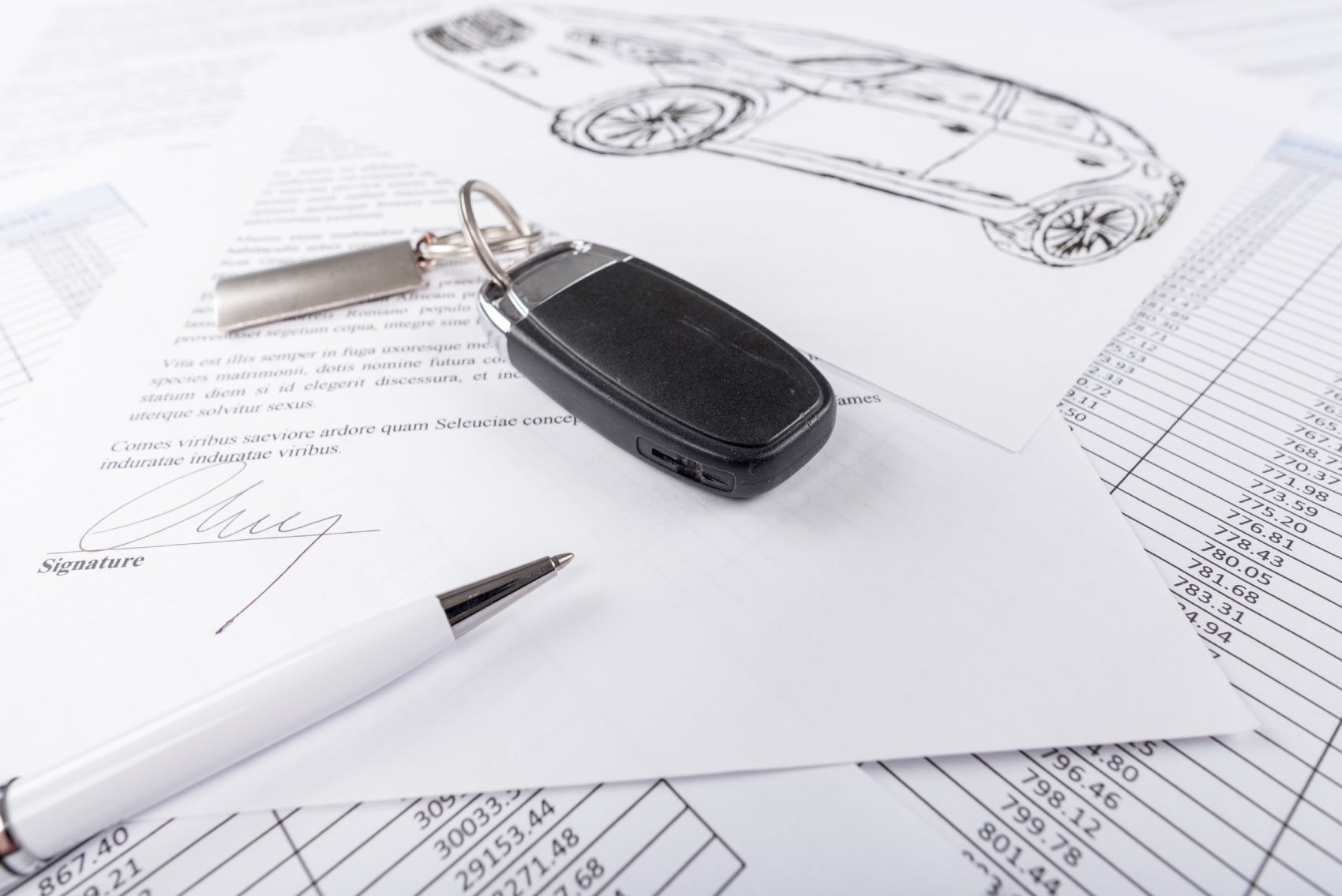 Completed Paperwork and Keys for a New Volkswagen