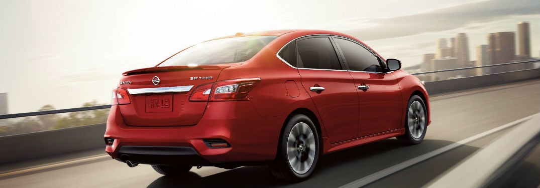 Nissan Sentra driving on a road