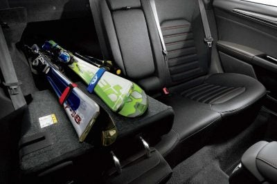 Interior rear space in the 2018 Ford Fusion with 60/40 split pass through with skis