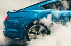 tires on ford mustang burning rubber and smoking