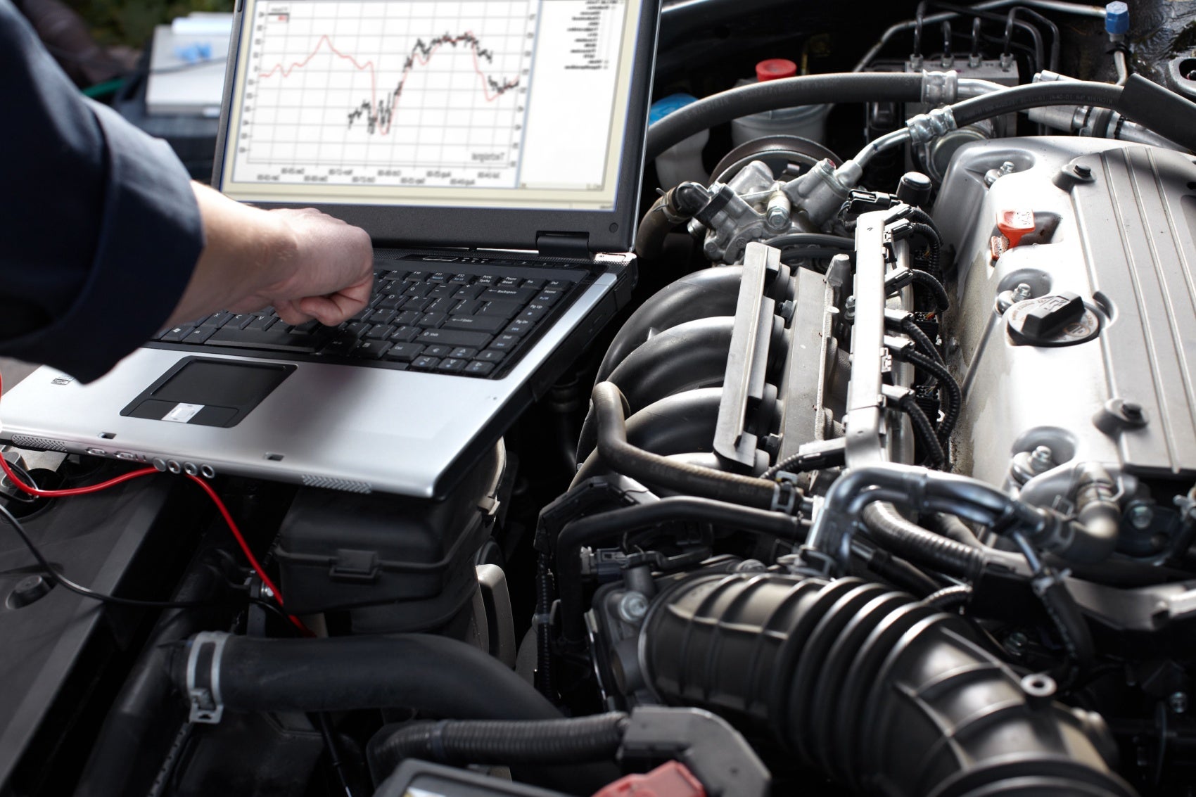 Service Technician Working on a Ford Engine