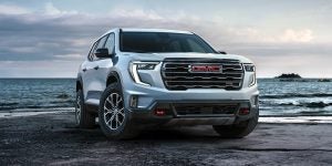 2024 gmc acadia on a beach shore