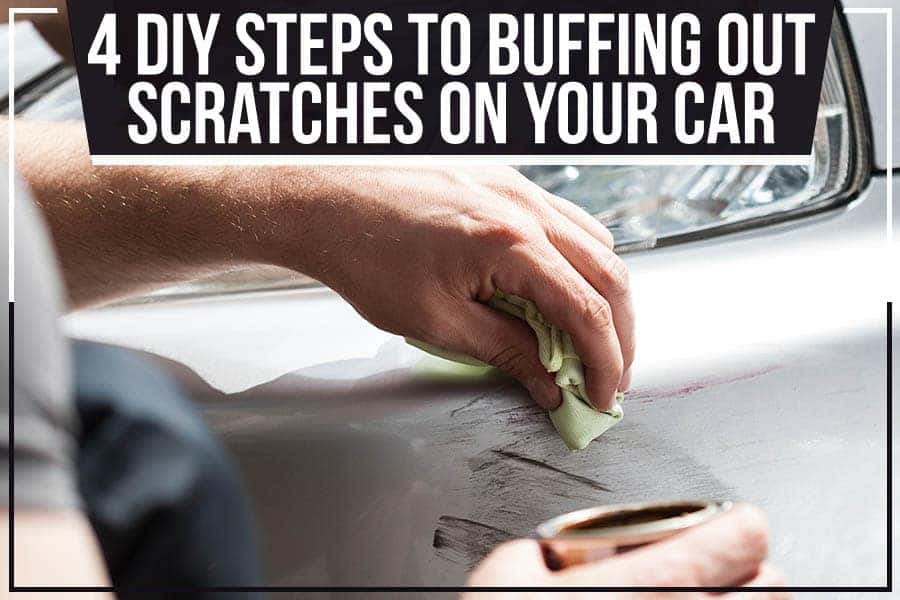 A person uses a specialized tool to pull a dent out of a white car door, with the interior visible.