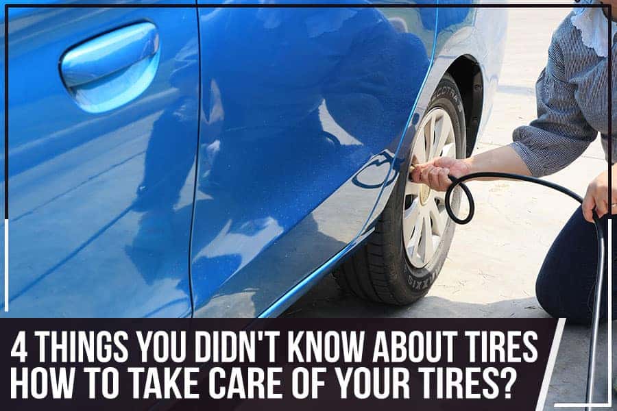 Man removing the wheel nuts of a raised white car with a wrench.