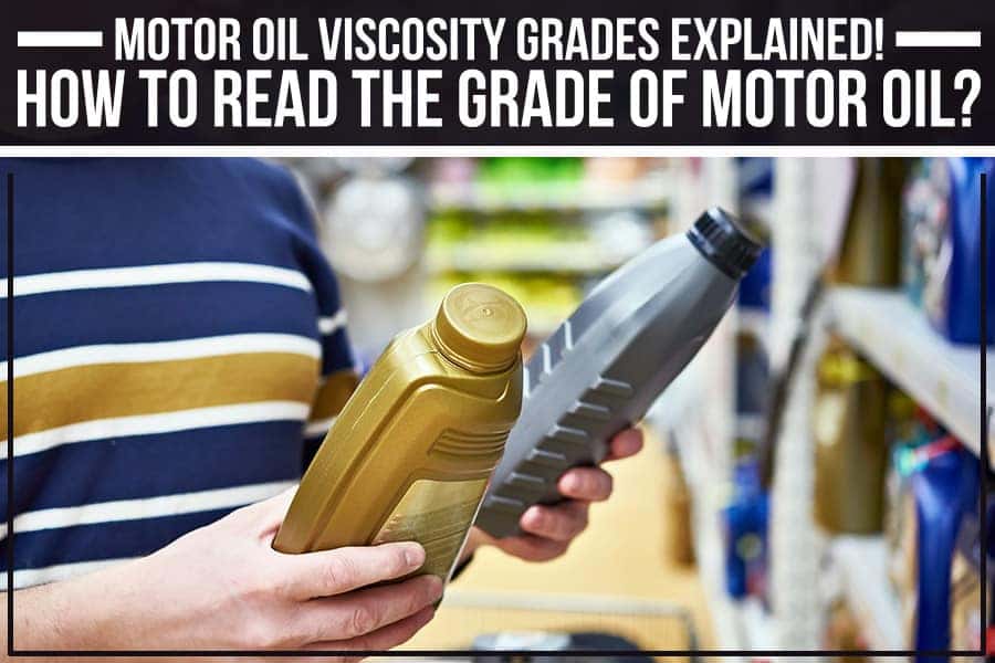 Motor oil is being poured from a gray bottle, creating a thick stream of amber liquid.