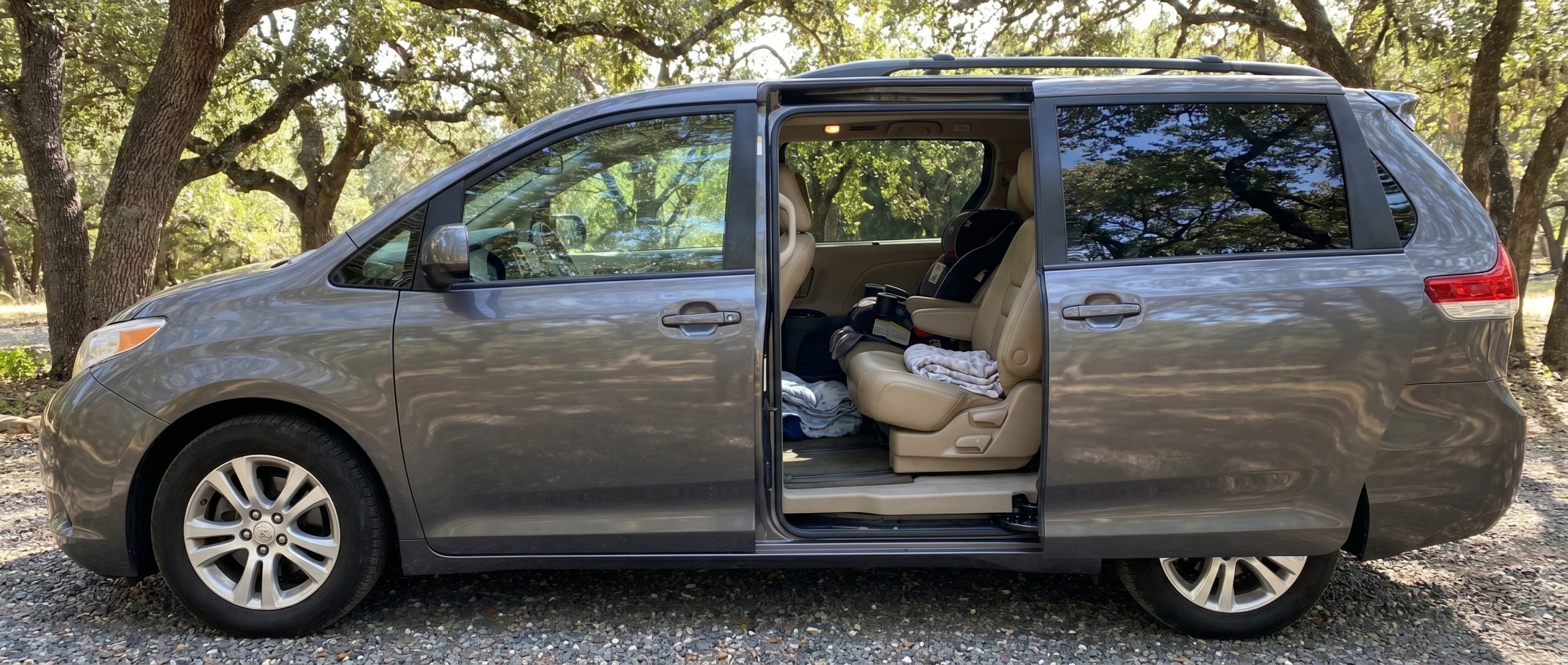 Pre-owned Honda Odyssey with open power sliding door parked in Hampstead MD