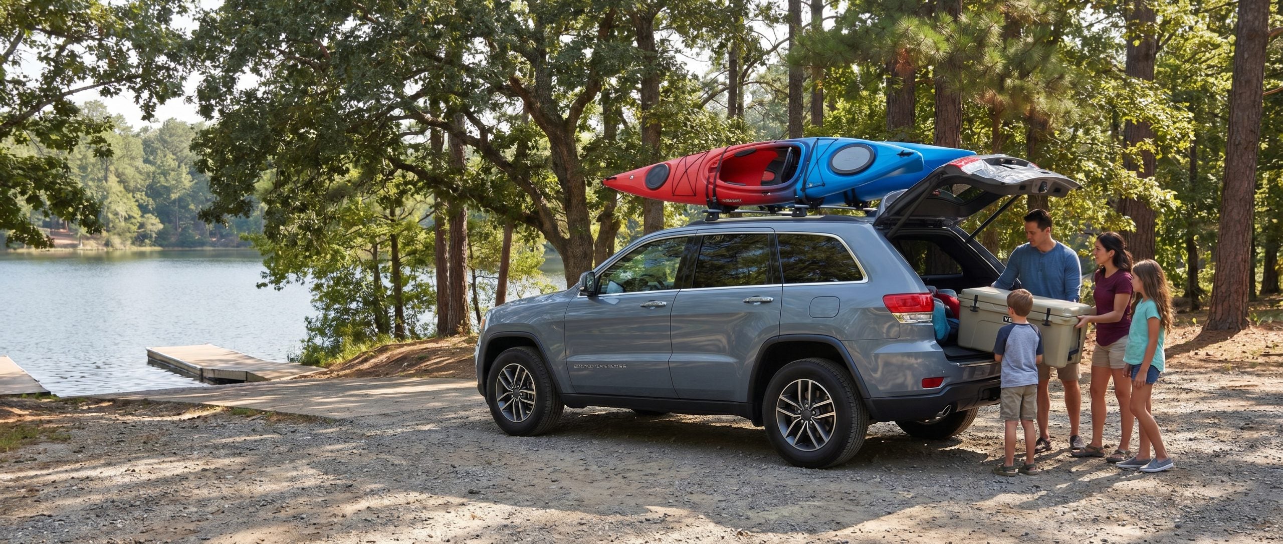 Pre-owned Jeep Grand Cherokee Overland trim parked near Piney Run Park water access.