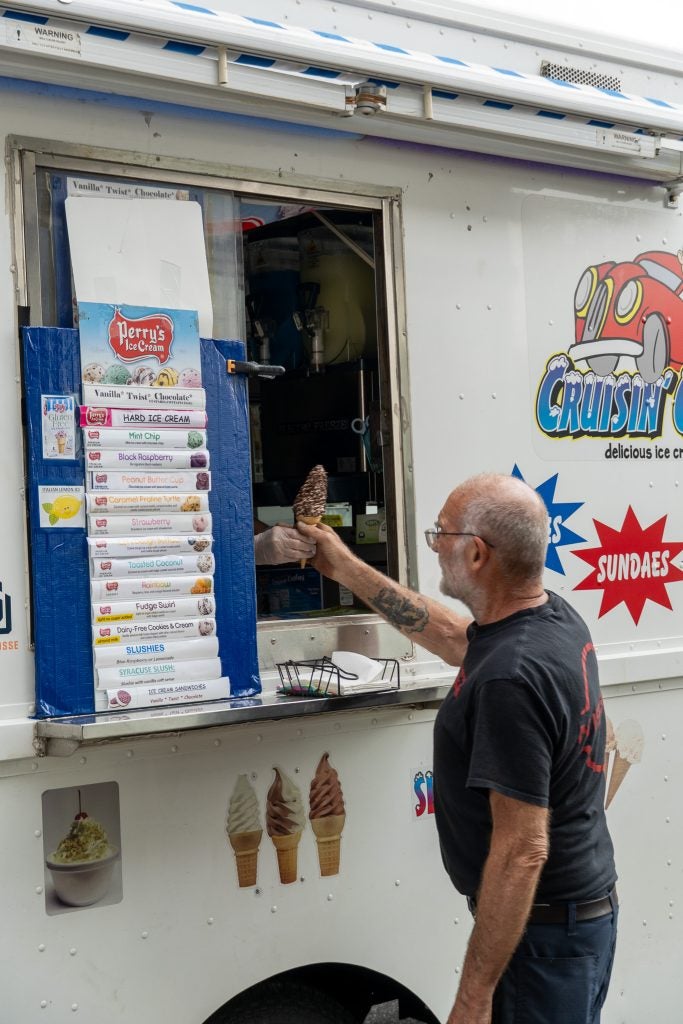 Master Technician, Karl Roessler getting a free ice cream courtesy of ACV Auto Auctions!