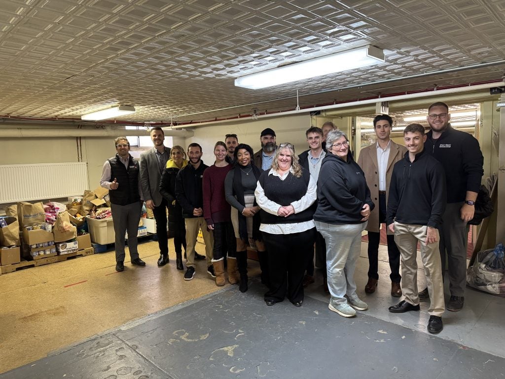 United Auto Sales and Steet Ponte Auto Group employees donating food to the Thea Bowman House in Utica, NY