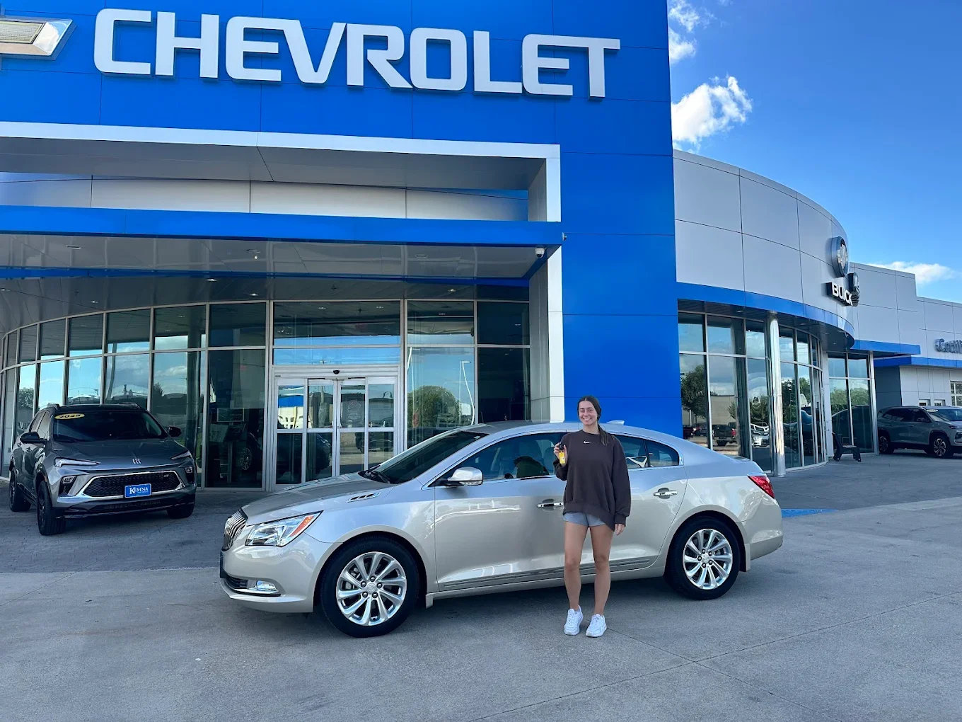 Kemna customer standing in front of the dealership