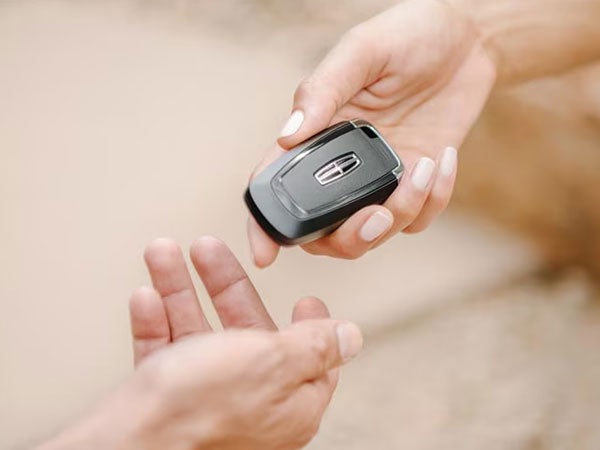 Lincoln Car Buyer Receiving Vehicle Key