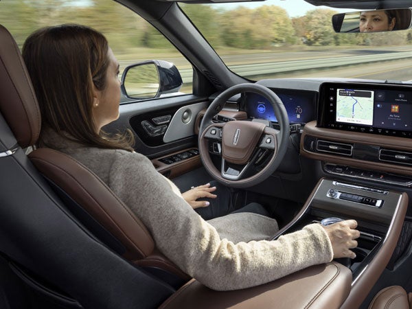 Woman Driving Lincoln Aviator SUV