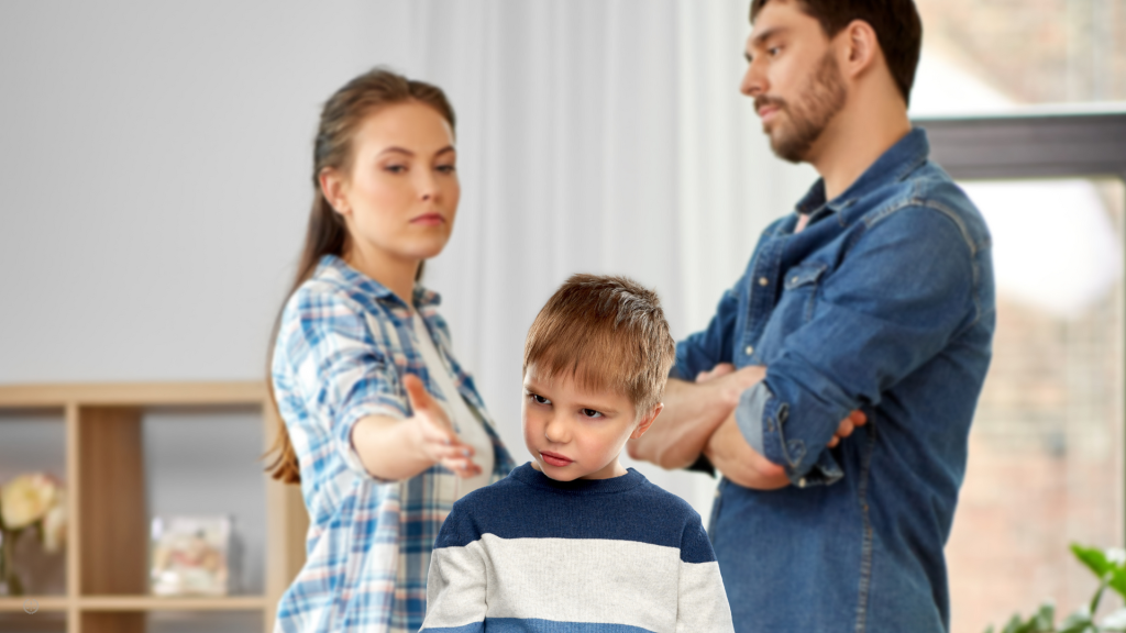 A couple argues behind a child