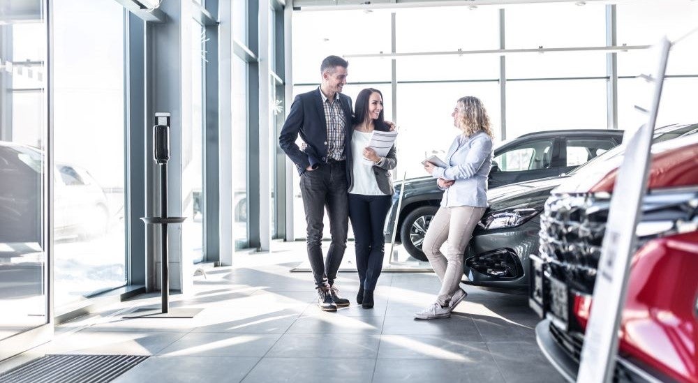 A couple car shopping at a dealership