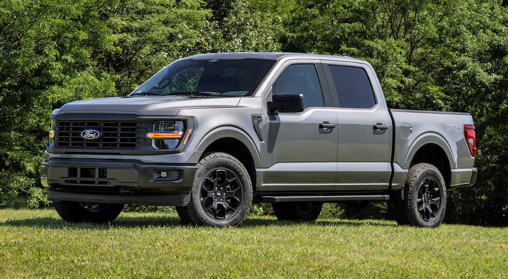 A grey 2025 Ford F-150 for sale near Des Plaines from the side.