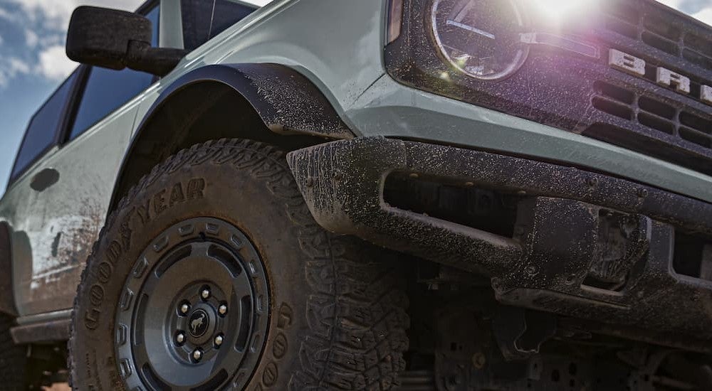Close-up of the wheel on a blue 2025 Ford Bronco for sale.