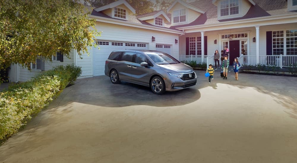 A parked silver 2025 Honda Odyssey for sale near Greenwood.