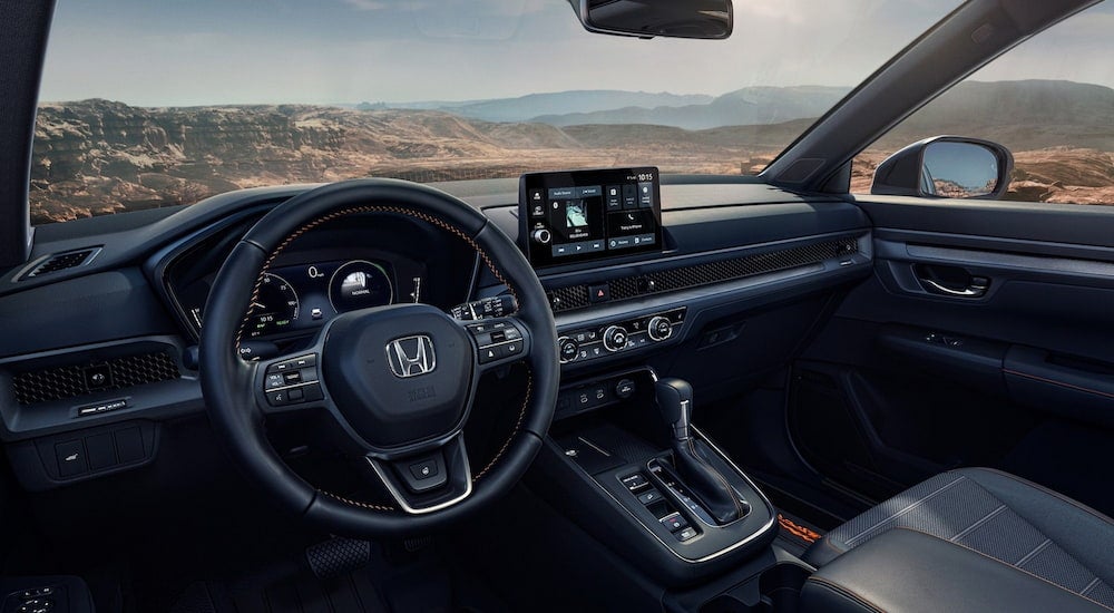The wheel and dashboard in the interior of a 2026 Honda CR-V.