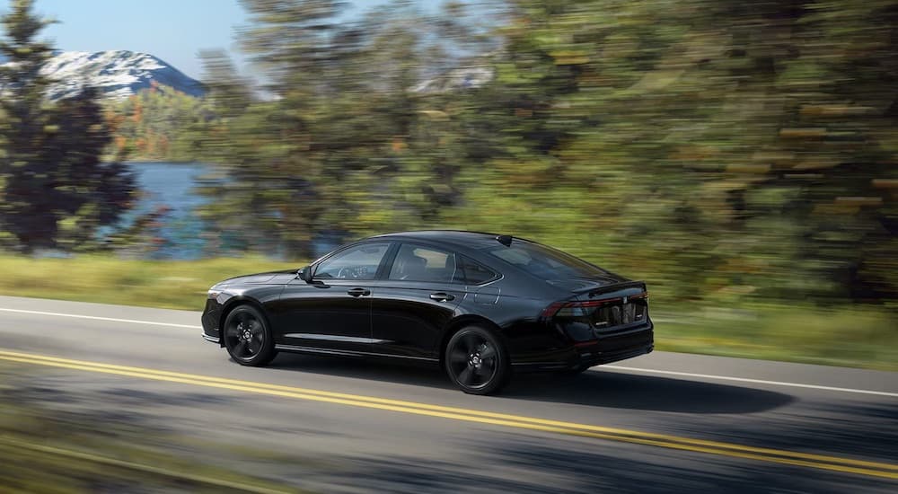 A black 2025 Honda Accord is shown from the side.