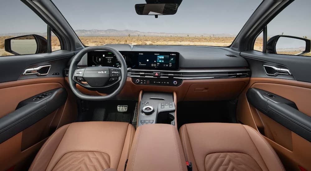 Brown leather interior and infotainment system in a 2026 Kia Sportage