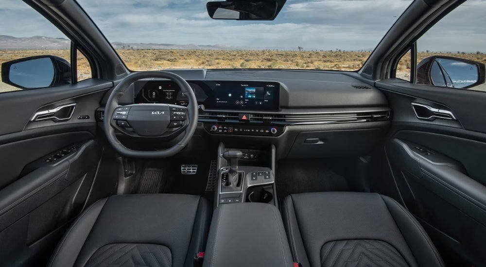 The black interior of a 2026 Kia Sportage.