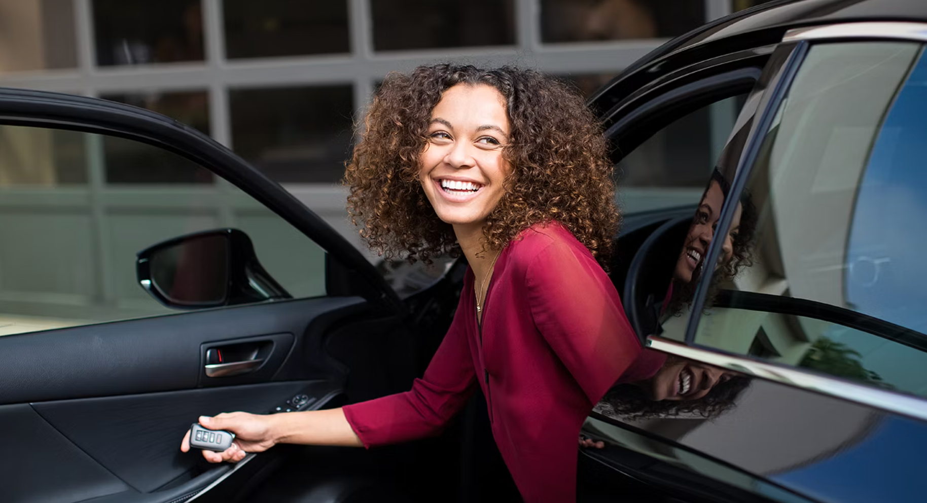 Woman dropping off her Lexus at a service center in Arlington Heights for the best oil change offer