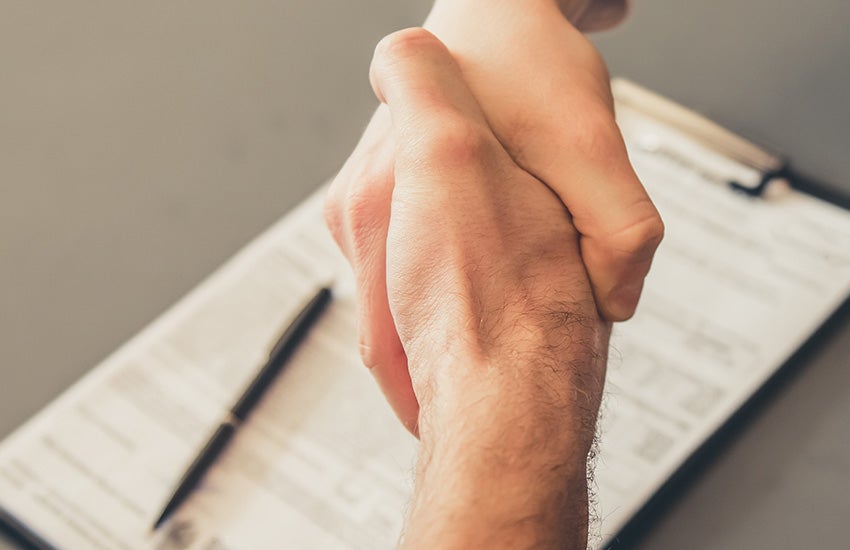 Car trade-in deal handshake