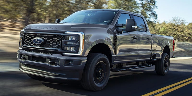 a 2025 Ford F-350 in the woods roadside