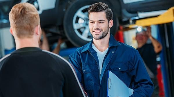 A service technician discussing transfer cases witth a customer