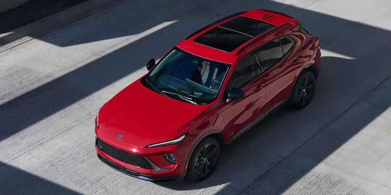 Red Buick Envision with a panoramic sunroof viewed from above